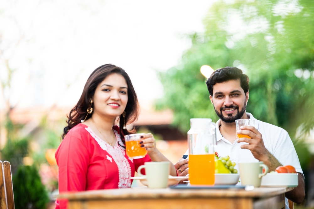 Indian,Husband,And,Wife,Having,Fresh,Juice,In,Breakfast,While