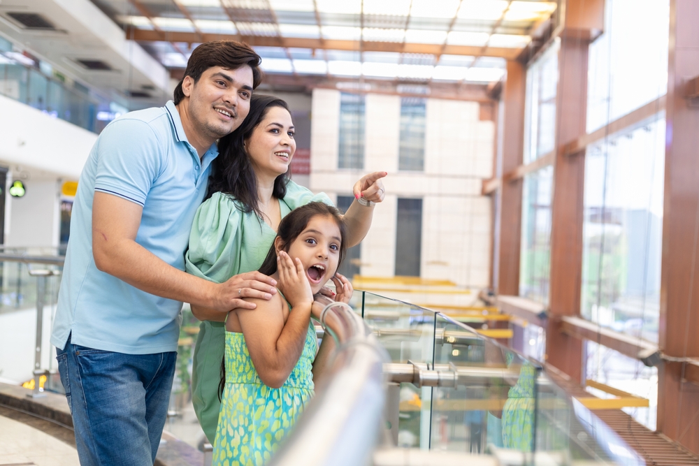 Happy,Indian,Family,Of,Three,Enjoying,In,Shopping,Mall.,Daughter