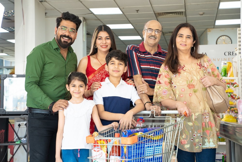 Indian,Family,Standing,Together,At,Grocery,Shop.